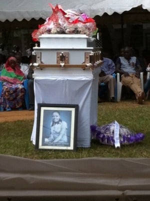 A portrait of Nanteza’s picture on her coffin in Masaka, a few minutes before it was laid to rest, Photo by Yasin Kakande,