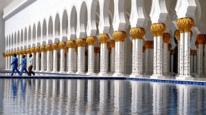 Migrant workers off start a days work at the Sheikh Zayed Grand Mosque in Abu Dhabi, UAE. © Alex Scott | Dreamstime.com